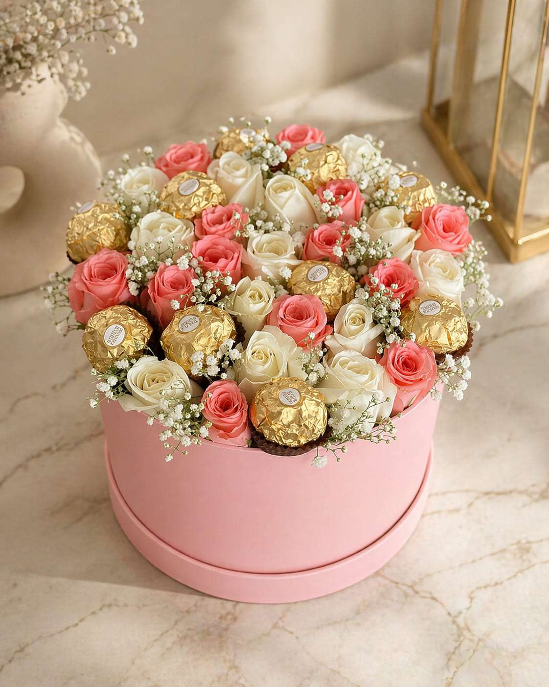 Pink hatbox of roses and Ferrero Rocher chocolates, gift delivery in Marrakech